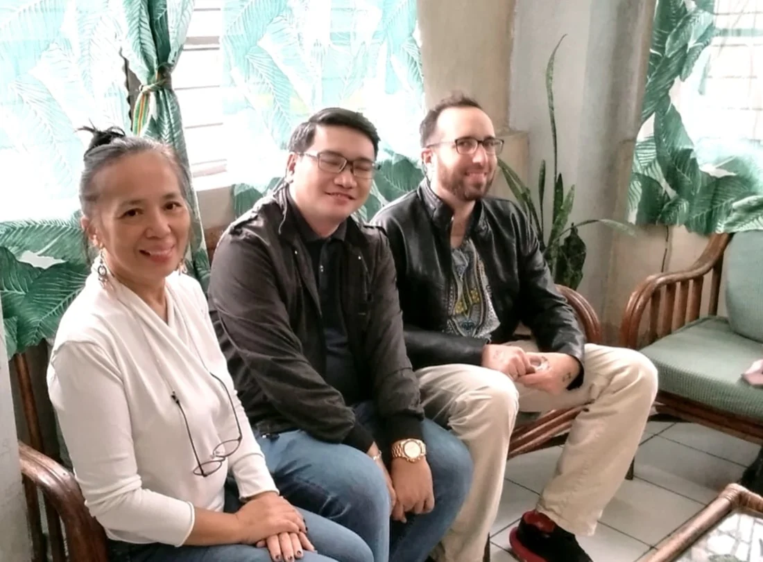 Maria Lourdes A. de Vera and Kyle Russell Anderson together with a colleague